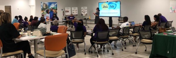 Abigail Flemin leads a community meeting