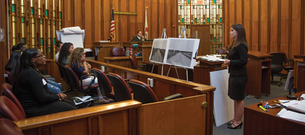 Lawyer addressing jury in courtroom