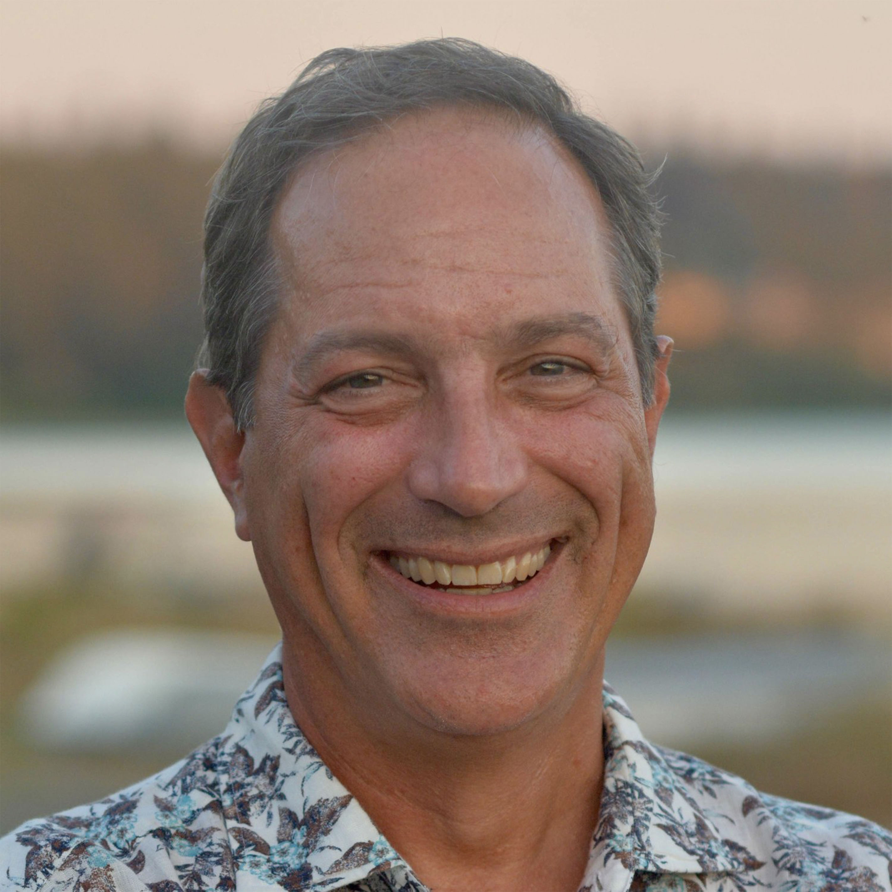 Headshot of Speaker 1
